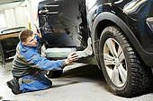 david nash smash repairs worker inspecting a car part